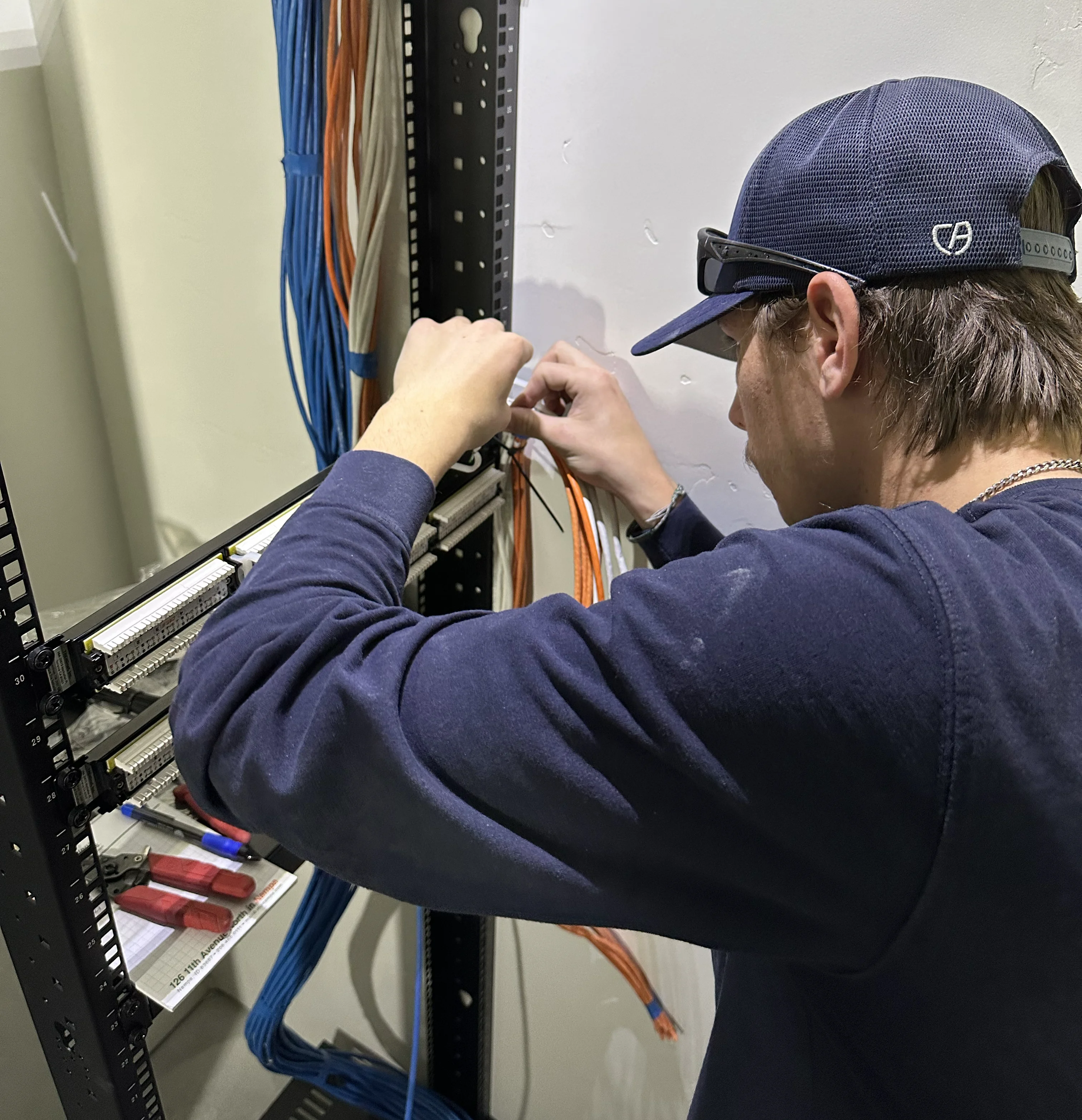 Benconnected technician working on network cables